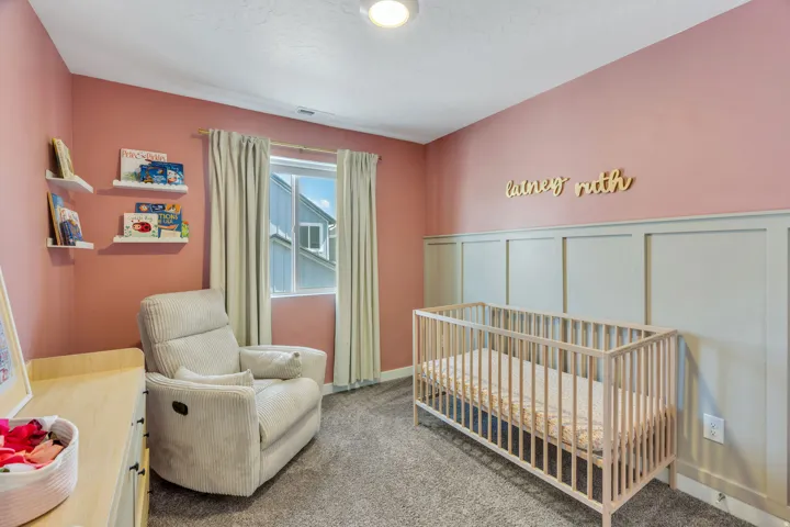 Board and batten wall accent, recessed lighting, window with light-filtering curtains, and wall-mounted shelving
