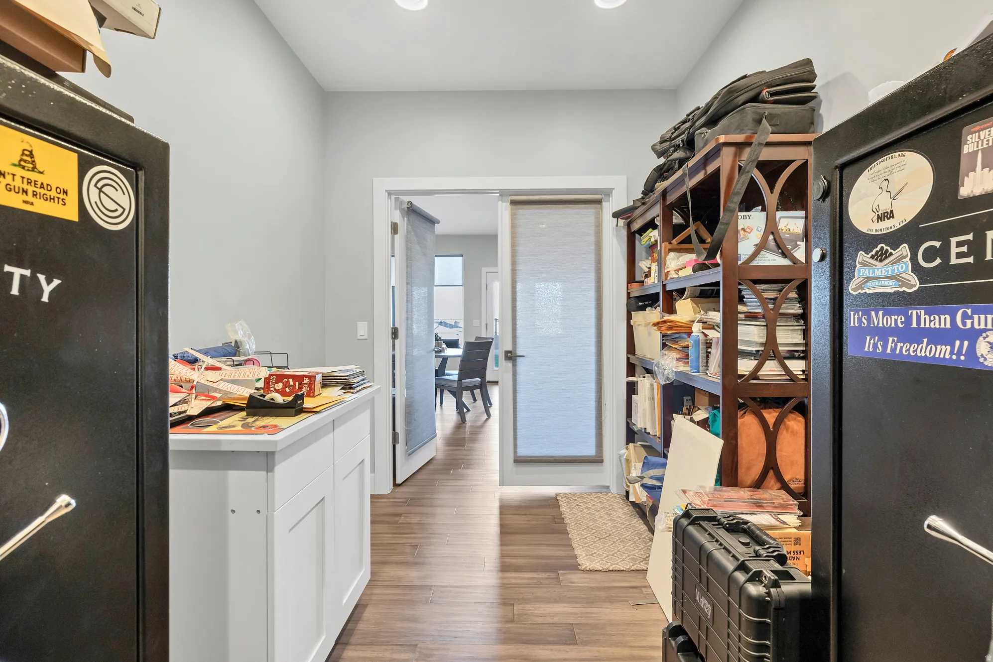 Recessed lighting illuminates wood-finish flooring