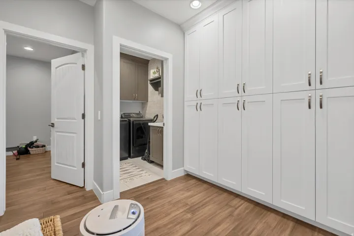 White shaker-style cabinetry with chrome hardware