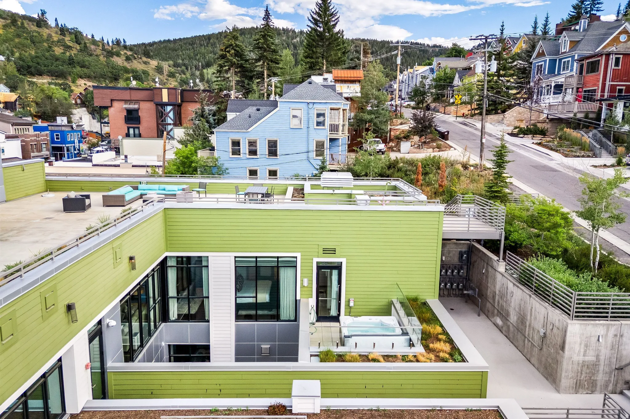 Rooftop terrace with integrated hot tub and modern glass railing