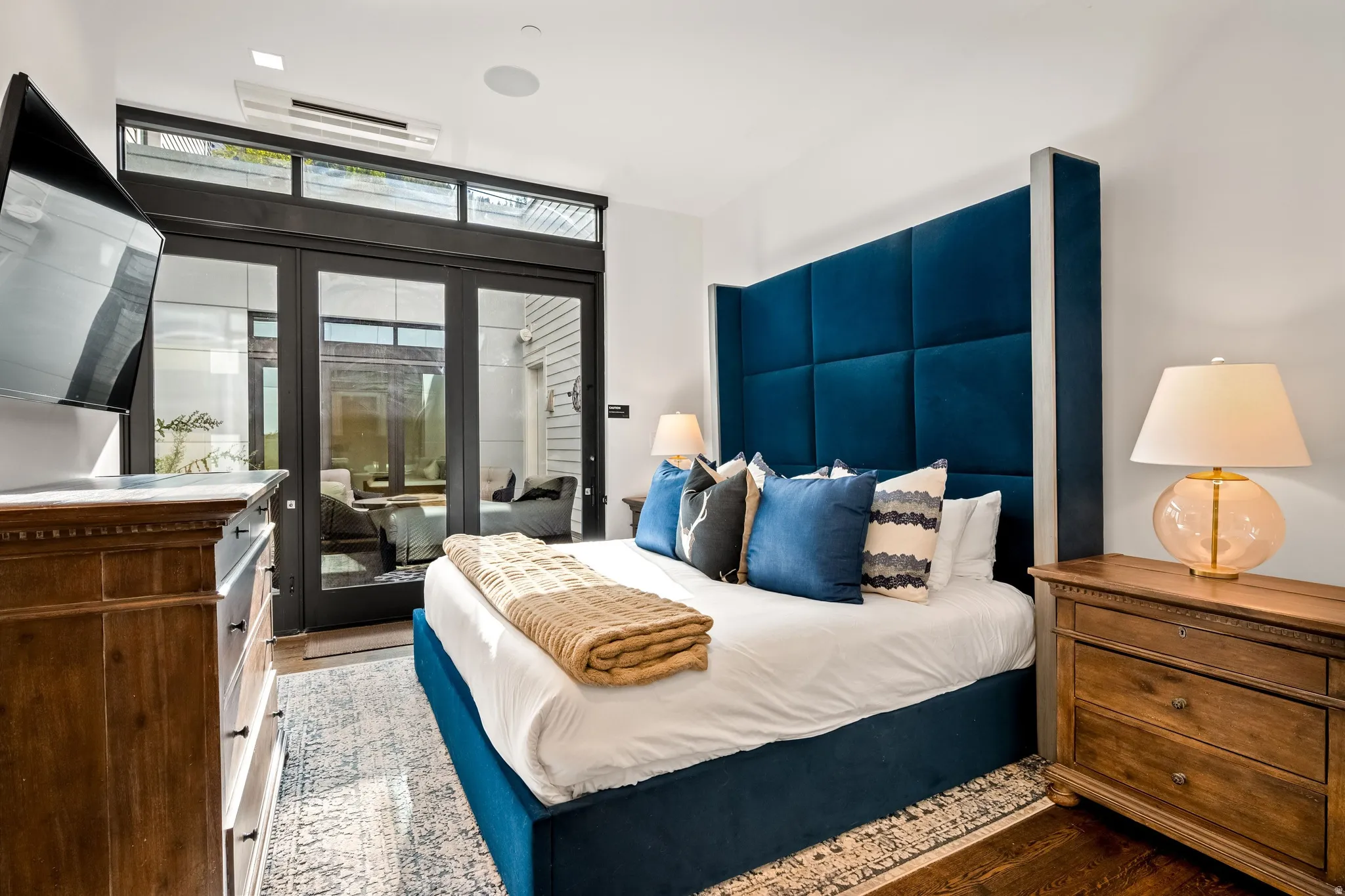 Hardwood flooring, recessed lighting, and a built-in wall speaker