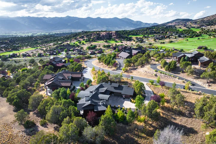 Aerial perspective showcasing multiple properties nestled among extensive natural landscaping