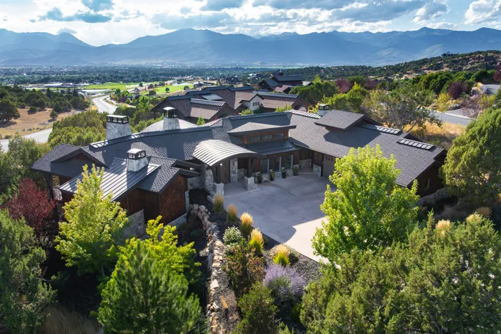 Mountain backdrop with an expansive, multi-level property