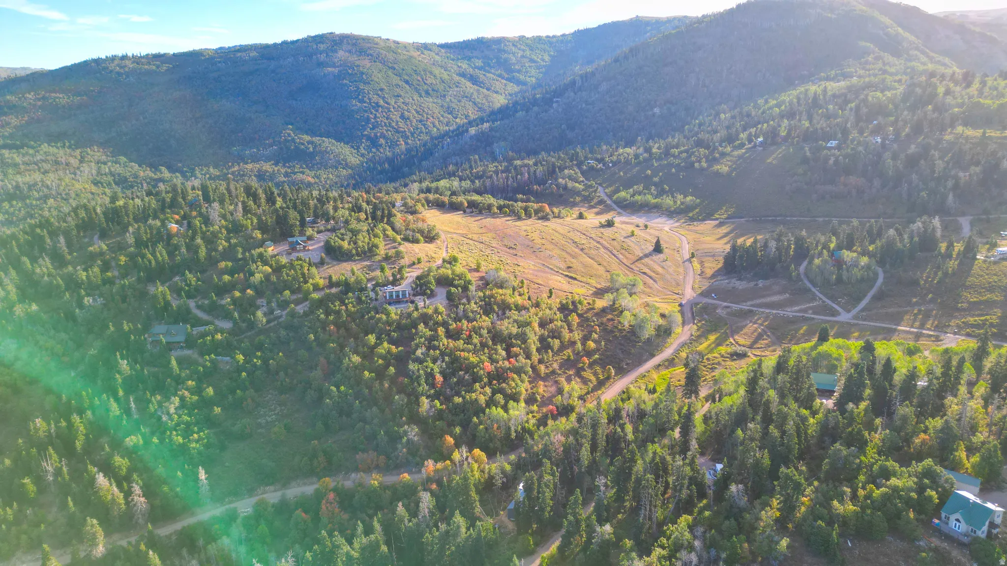 Expansive mountainous terrain with varied tree coverage