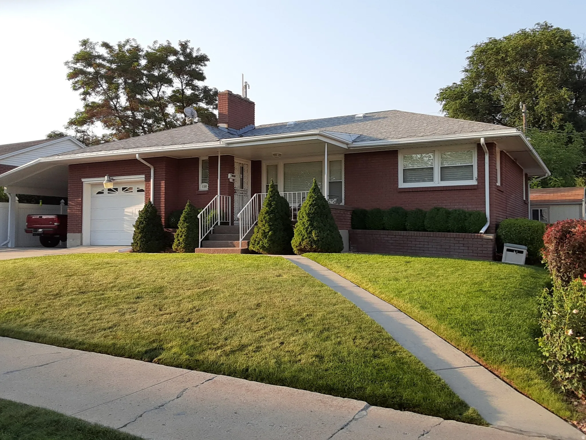 Front of Home - 1 car garage, 1 car carport and great curb appeal!
