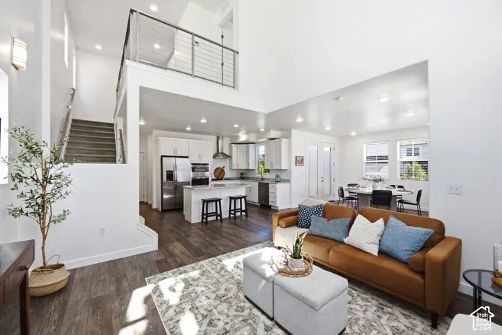 High ceilings and laminate flooring throughout the open-concept space