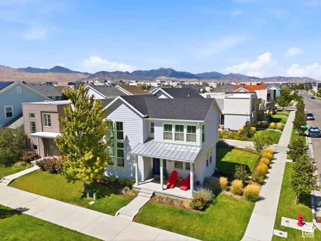 Two-story residence with a covered front porch and gabled roof