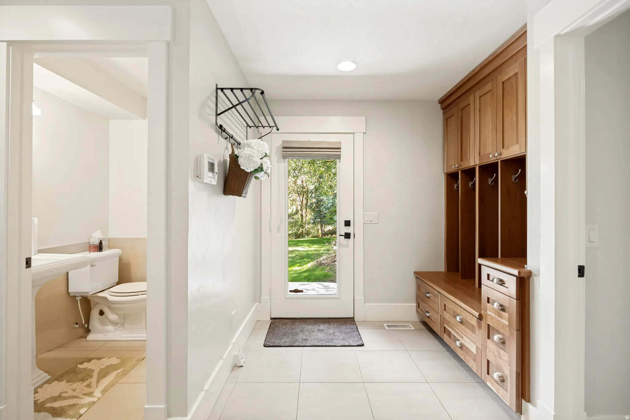 Wood-finish built-in cabinetry with integrated bench seating