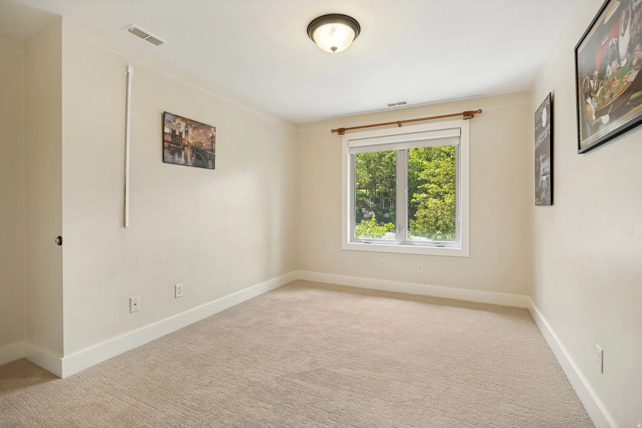 Carpeted flooring, recessed window, flush-mount ceiling light fixture, white trim