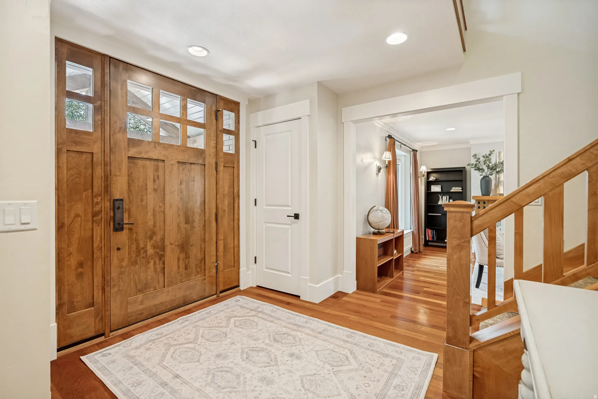 Craftsman-style front door with glass panels and sidelights