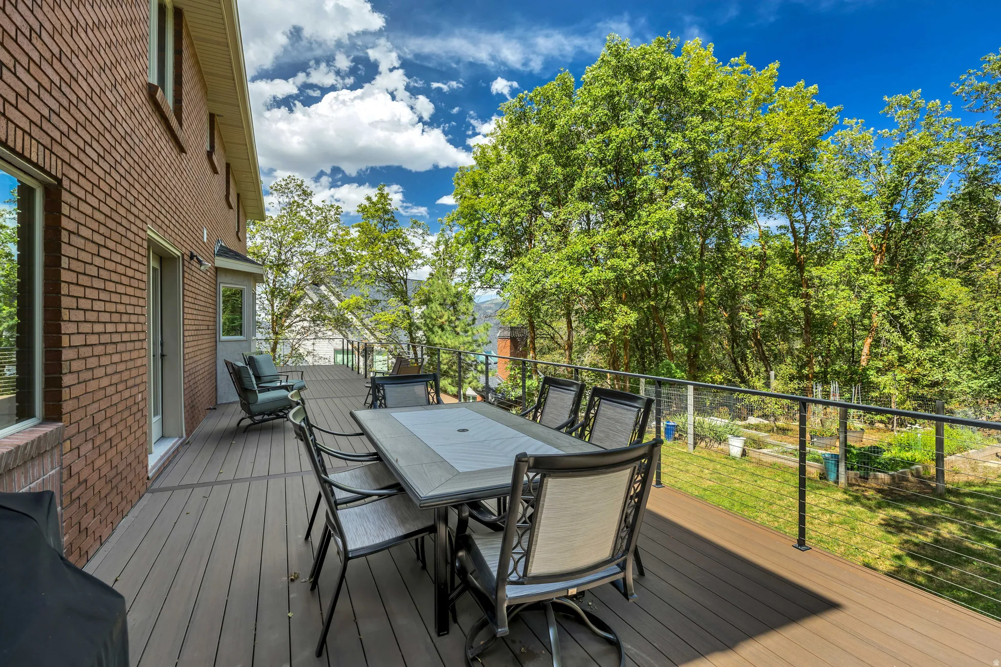 Expansive deck with composite decking, cable railing