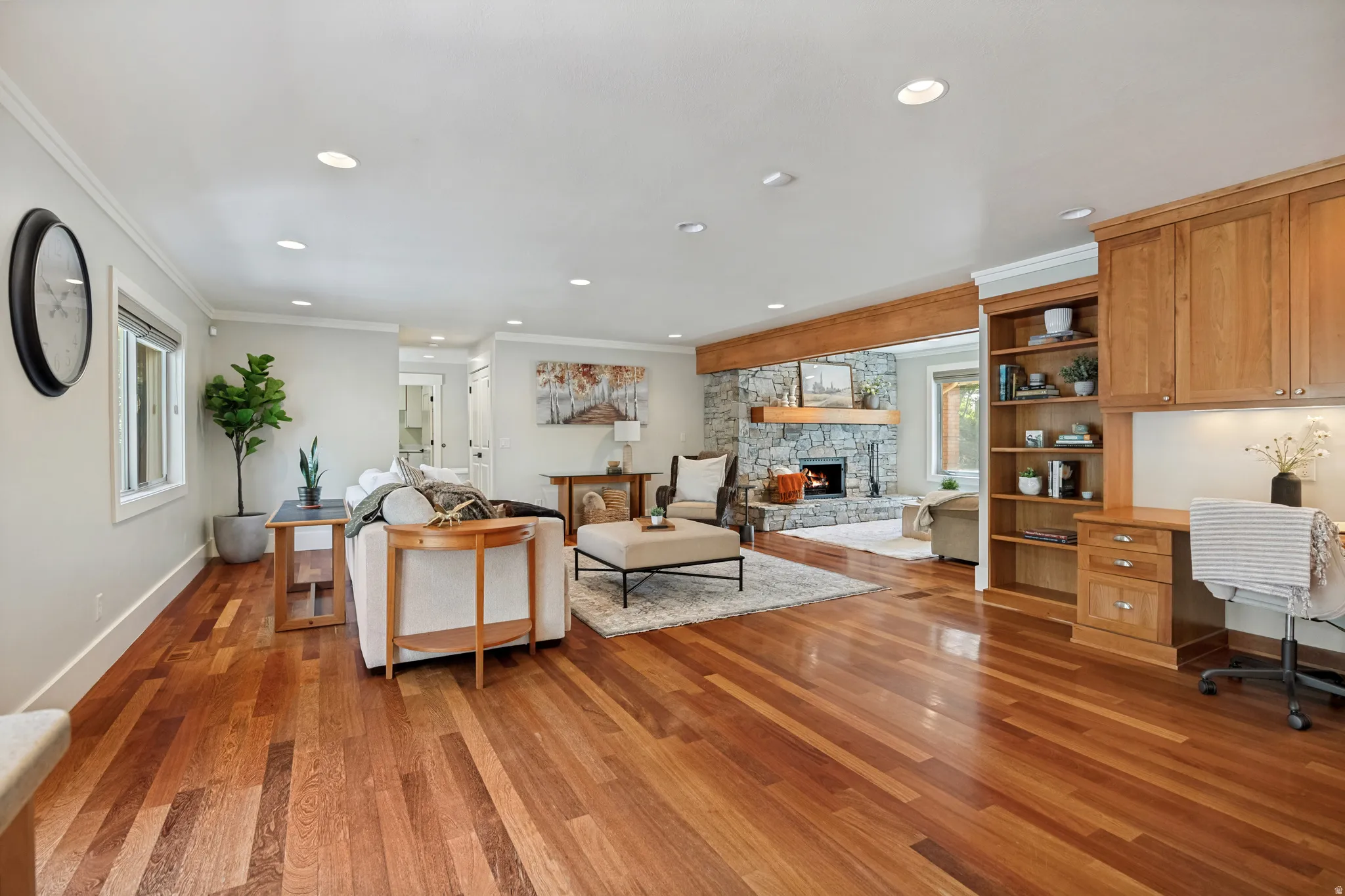 Warm wood-finish flooring throughout, complemented by recessed lighting