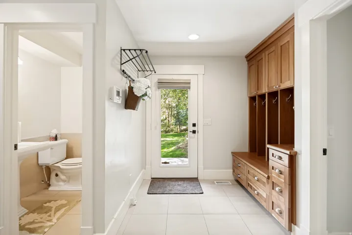 Wood-finish built-in cabinetry with integrated bench seating
