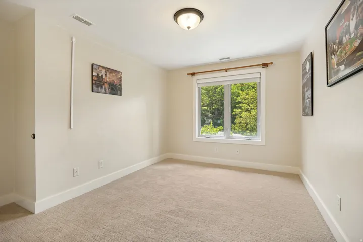 Carpeted flooring, recessed window, flush-mount ceiling light fixture, white trim