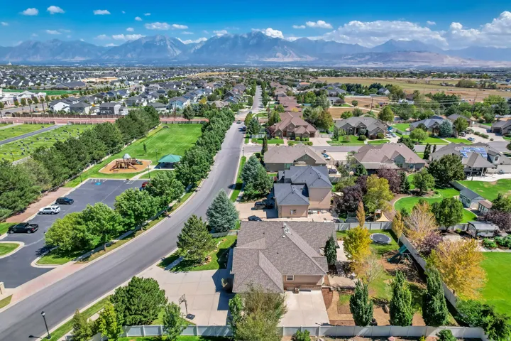Expansive neighborhood with diverse residential architecture and mature landscaping