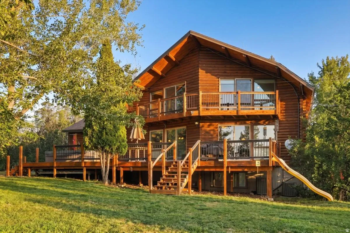 Log-sided exterior with multiple outdoor deck spaces