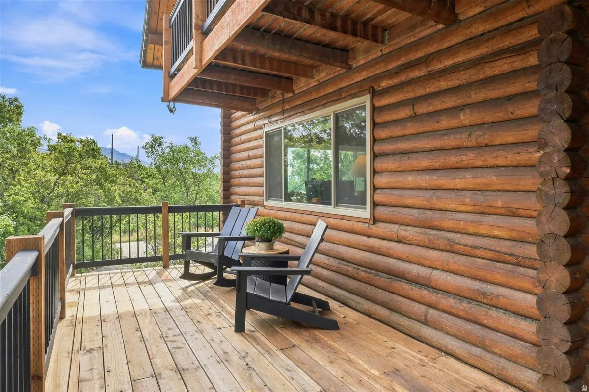 Wood-plank deck with black metal spindle railings