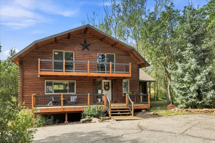 Log cabin exterior with an A-frame roof