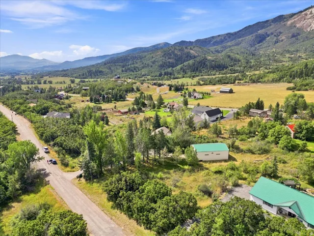 Mountainous backdrop with expansive green landscape