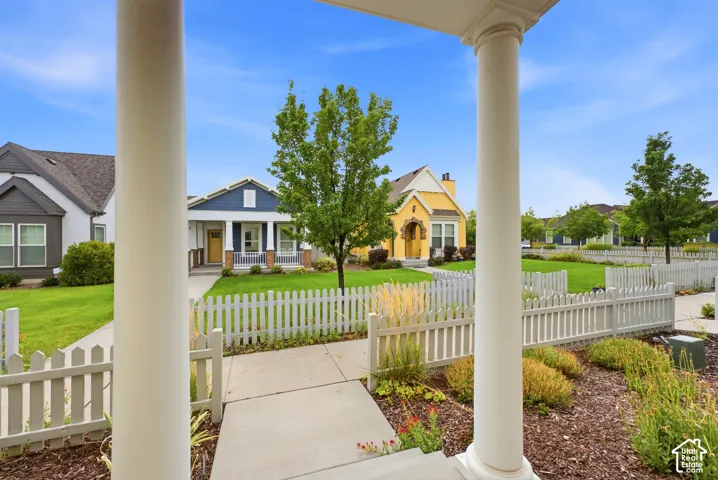 White picket fence framing the front yard
