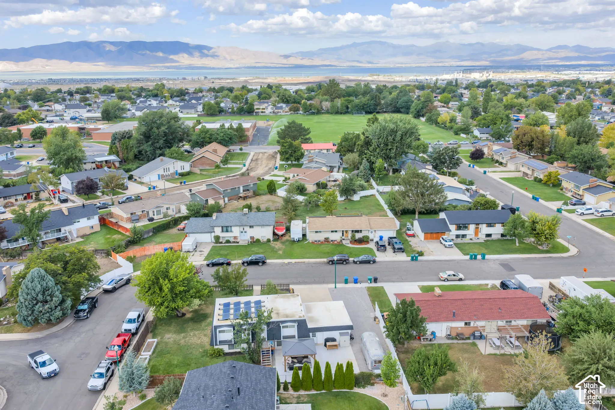 Residential neighborhood with a distant mountain and body of water backdrop