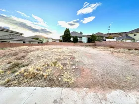 Vacant lot featuring a concrete sidewalk