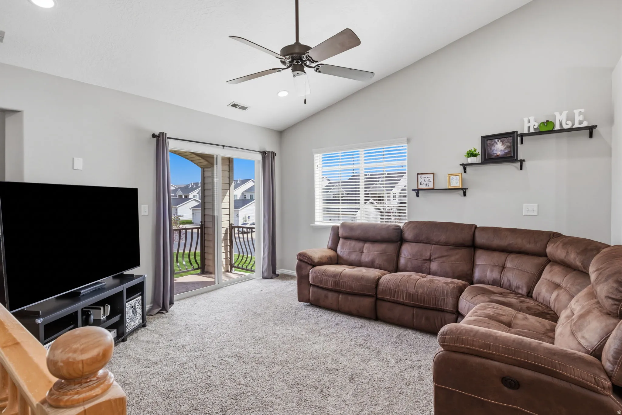 Vaulted ceiling with a ceiling fan, recessed lighting, and soft gray walls