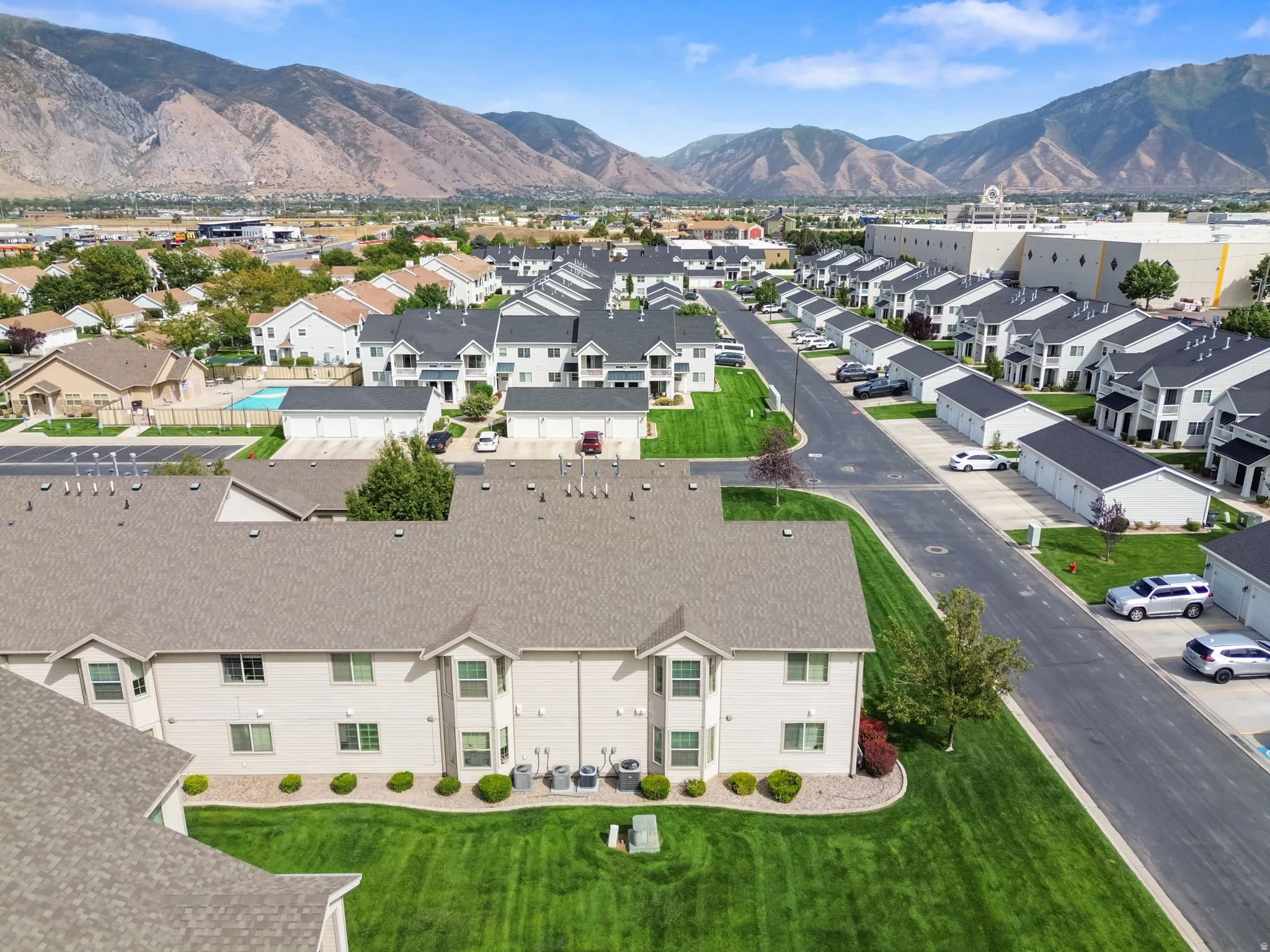 Expansive community with manicured green spaces and paved roadways