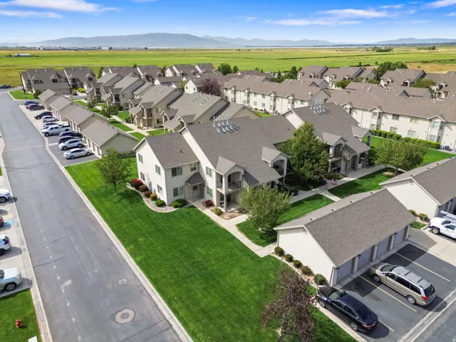 Expansive green spaces and mature landscaping complement the property exteriors