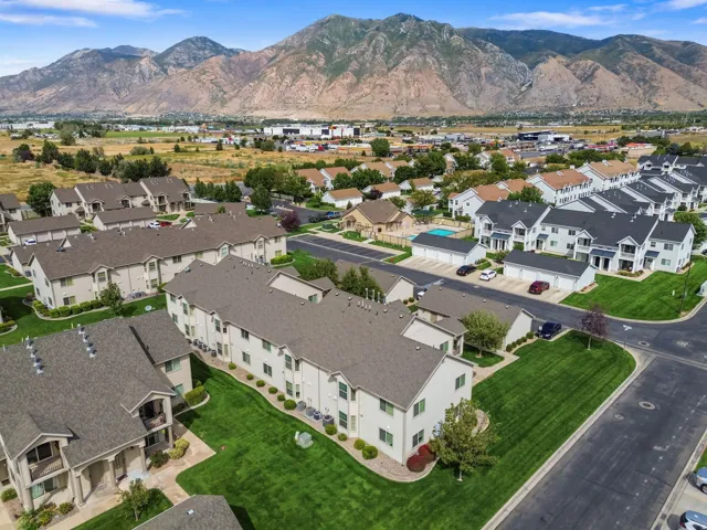 Townhome community with extensive green spaces and mountain backdrop