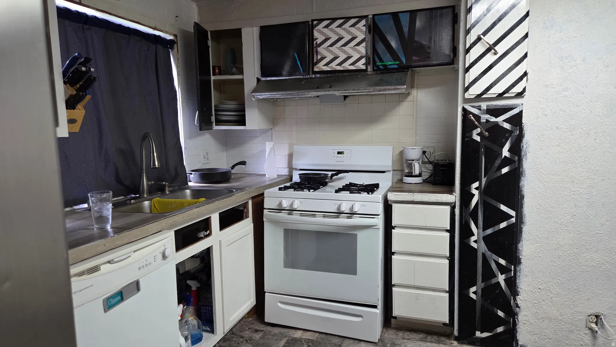 White appliances, white cabinetry, light-toned countertop, and a stainless steel sink with a gooseneck faucet