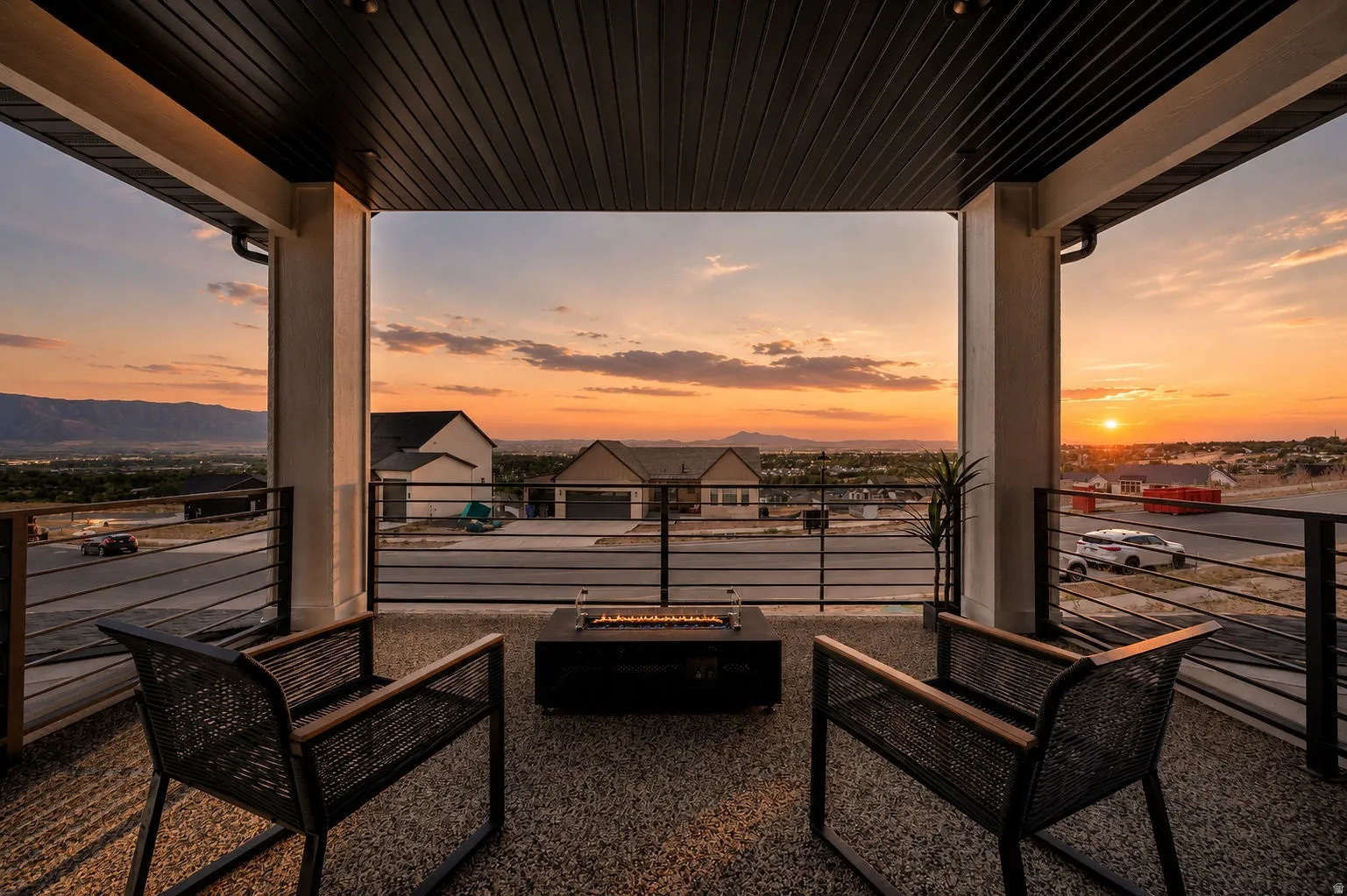 Covered patio with a flat panel ceiling, recessed lighting, and metal railing