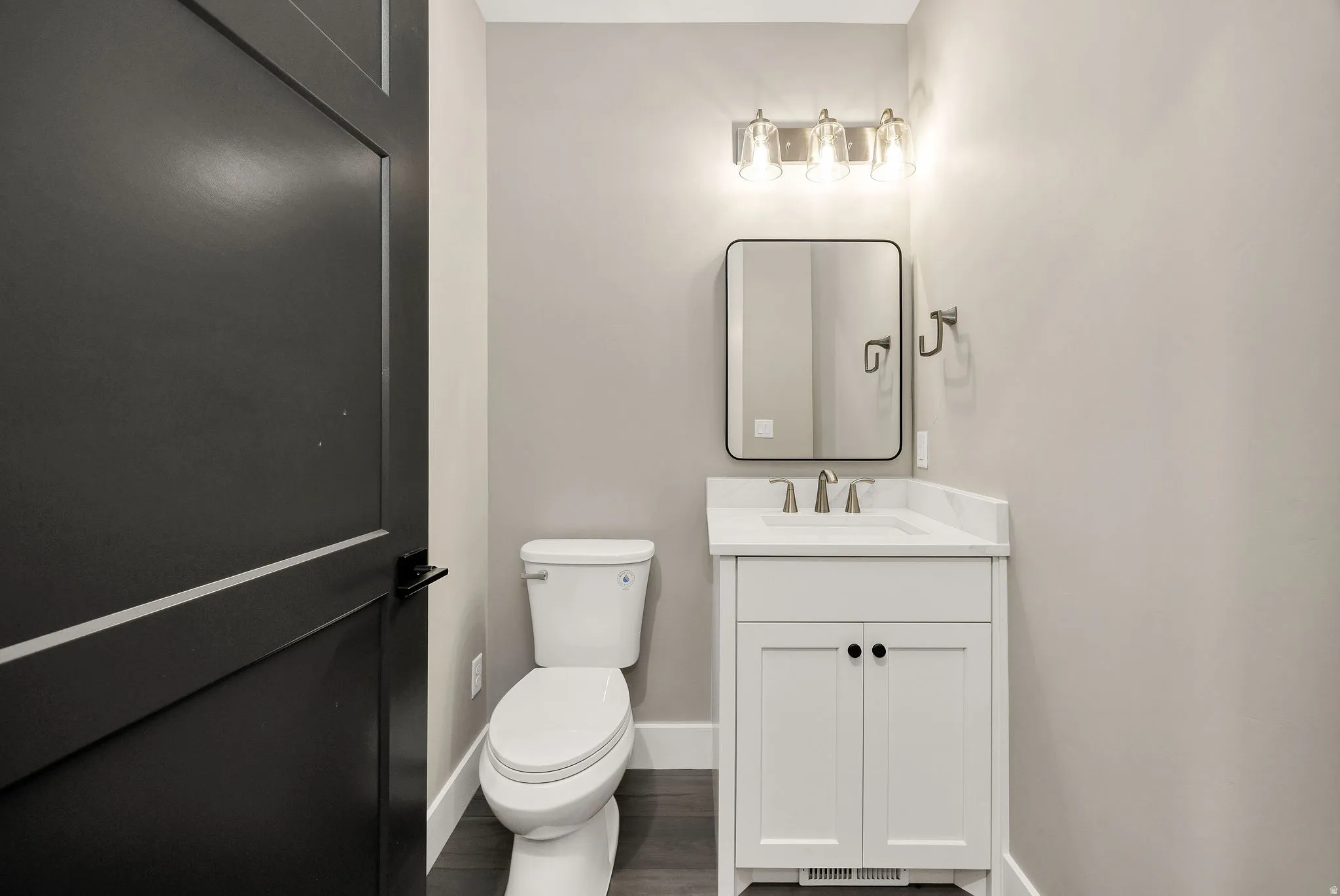 White vanity with integrated sink and chrome faucet