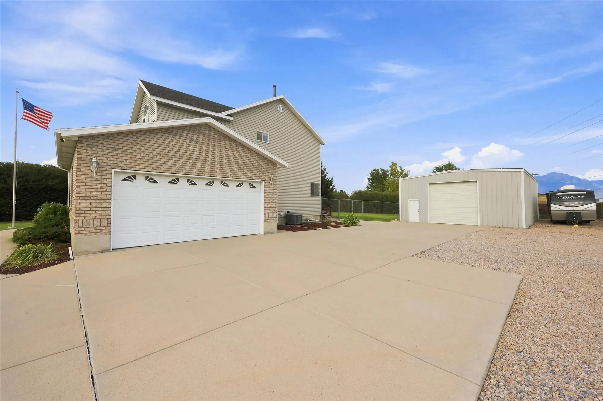 Attached two-car garage with brick veneer facade