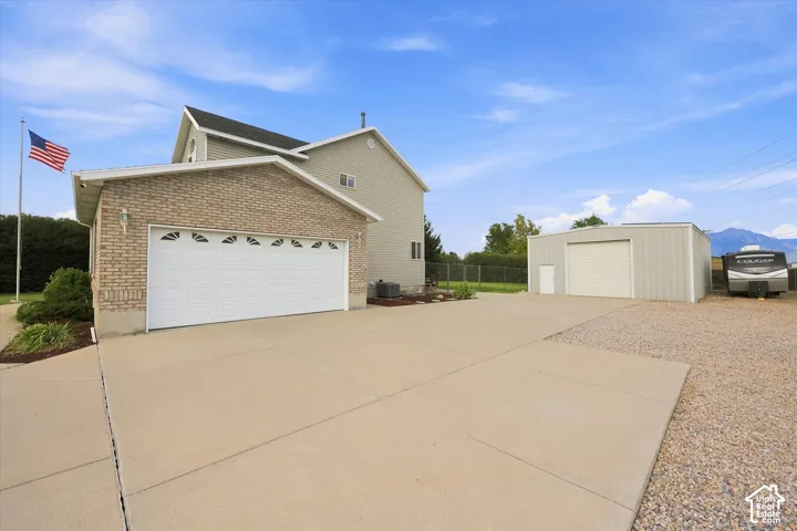 Attached two-car garage with brick veneer facade