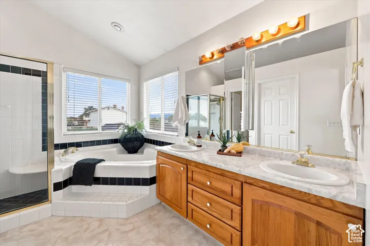 Dual vanity with wood-finish cabinetry and integrated sinks