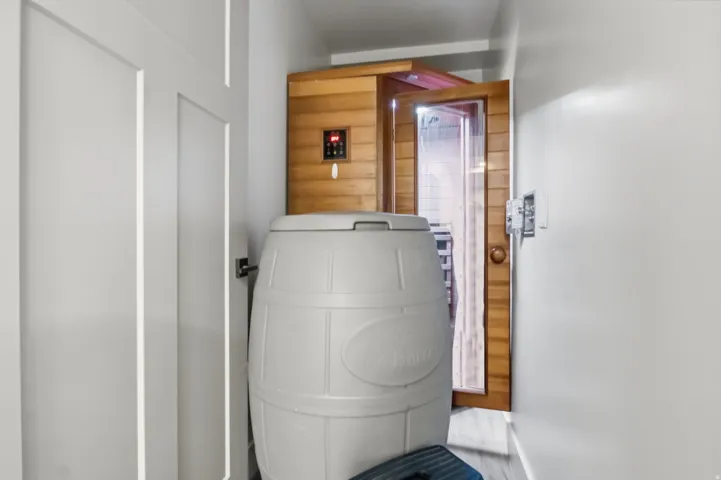 Sauna and cold plunge room off gym with hose bib and outlets
