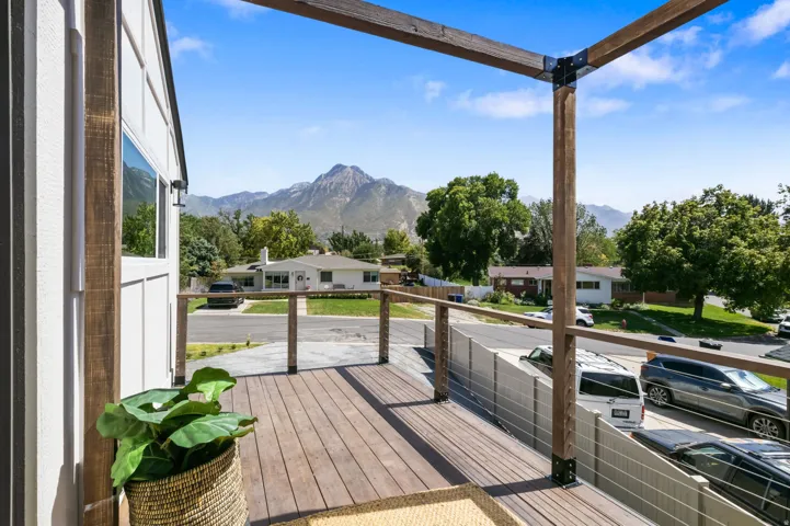 Wood-finish deck with cable railing and overhead pergola framework, wired for hot tub with stunning views of mt olympus