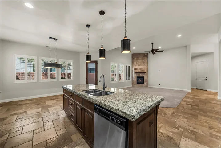 Kitchen island with granite countertop and stainless steel appliances