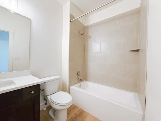Tub and shower combination with light-toned tiled surround