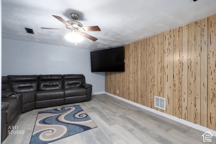 Wood-finish flooring with accent wall paneling