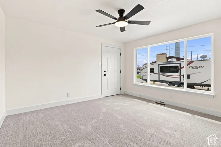 Master bedroom suite with neutral-toned walls and plush carpeting
