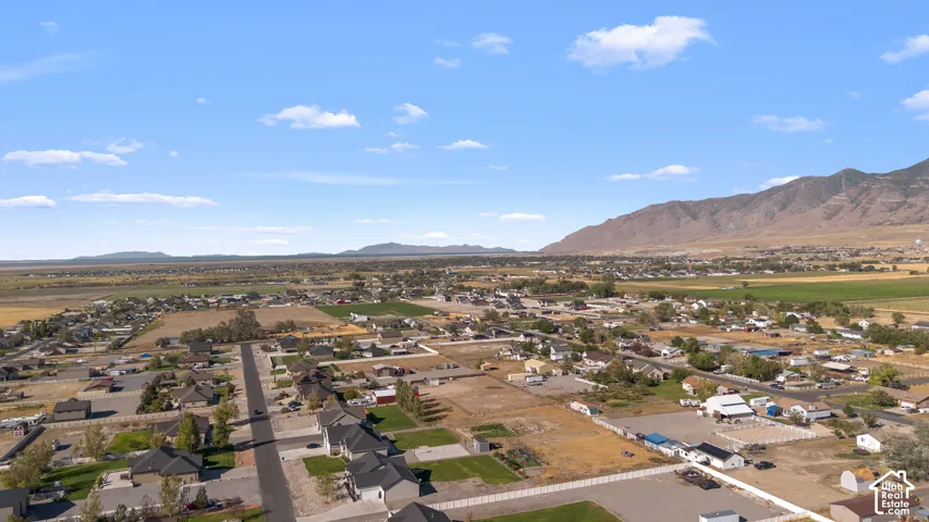 Mountain backdrop, residential area, and open fields