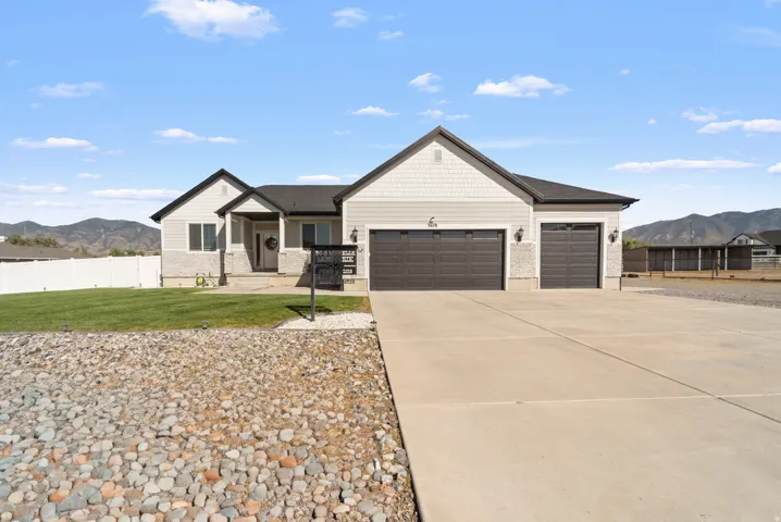 Light gray exterior siding with stone accents