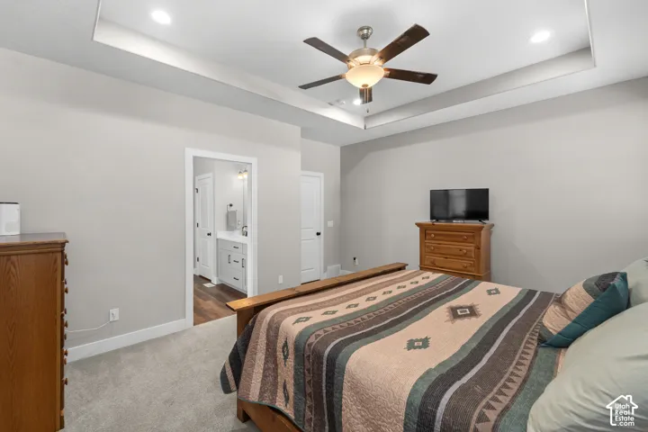 Tray ceiling with recessed lighting and a ceiling fan