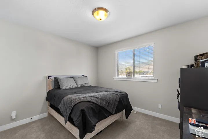 Recessed window with blinds, overhead flush mount light fixture, and light gray wall paint