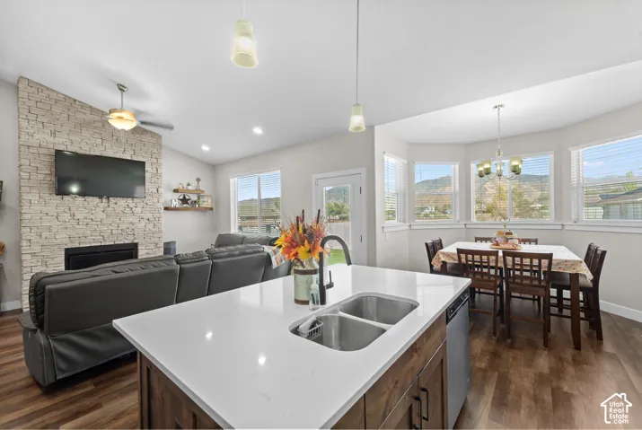 Open-concept living area featuring wood-finish flooring