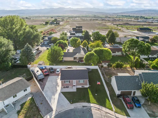Residential property featuring a concrete driveway and an attached garage