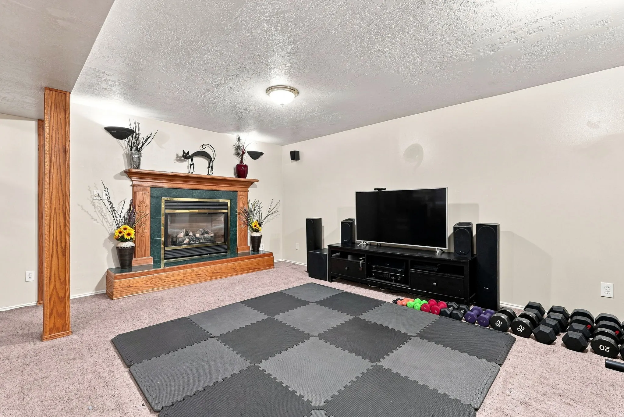 Fireplace featuring a wood mantel and green surround
