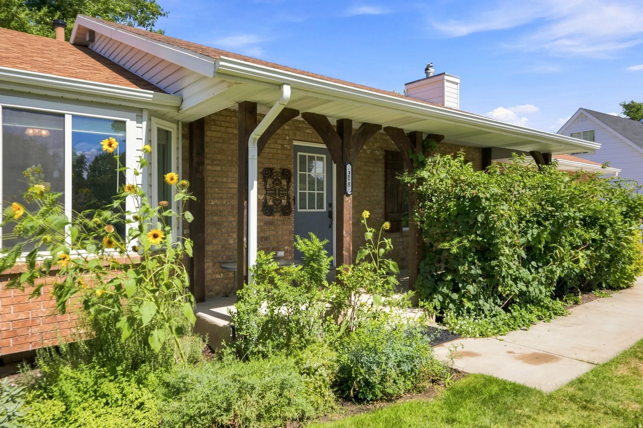 Brick exterior with a covered entry